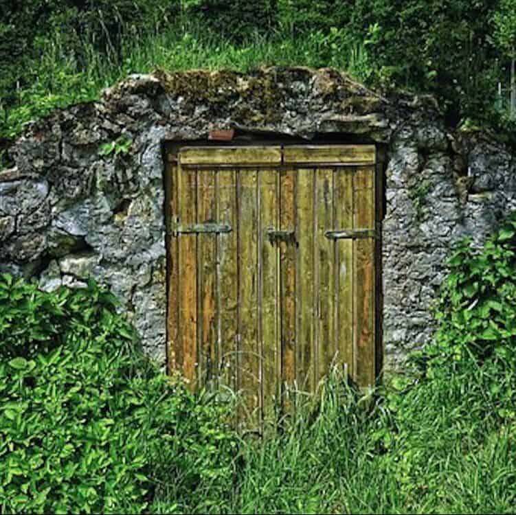 Food Preservation - door to a root cellar built into a hillside