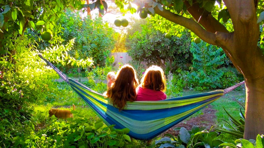 mom and daughter together in hammock